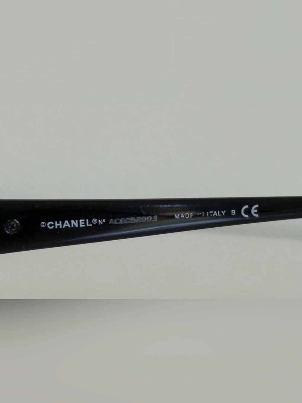 CHANEL Frame Black Rectangular Glasses with Camellia Temple Accent